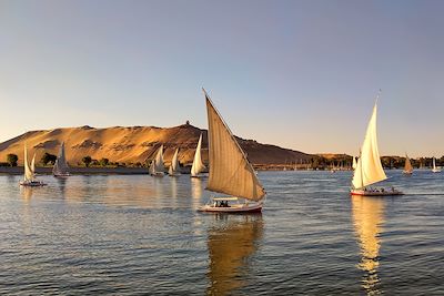 © Olga / Getty Images - Bateaux à voile sur le Nil Bateaux à voile sur le Nil